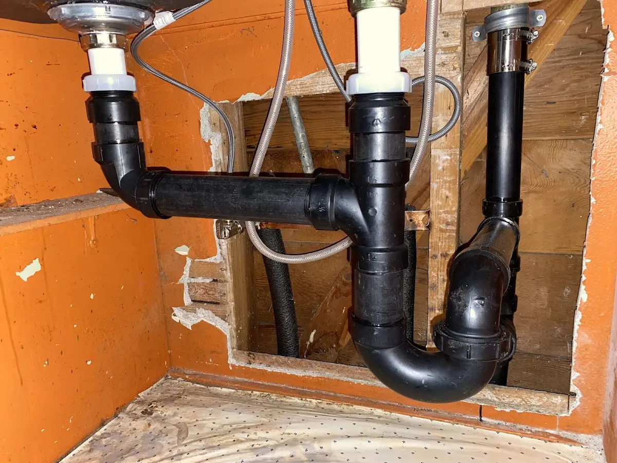 Professional Garbage Disposal Repair equipment and tools on the job in Fairfax